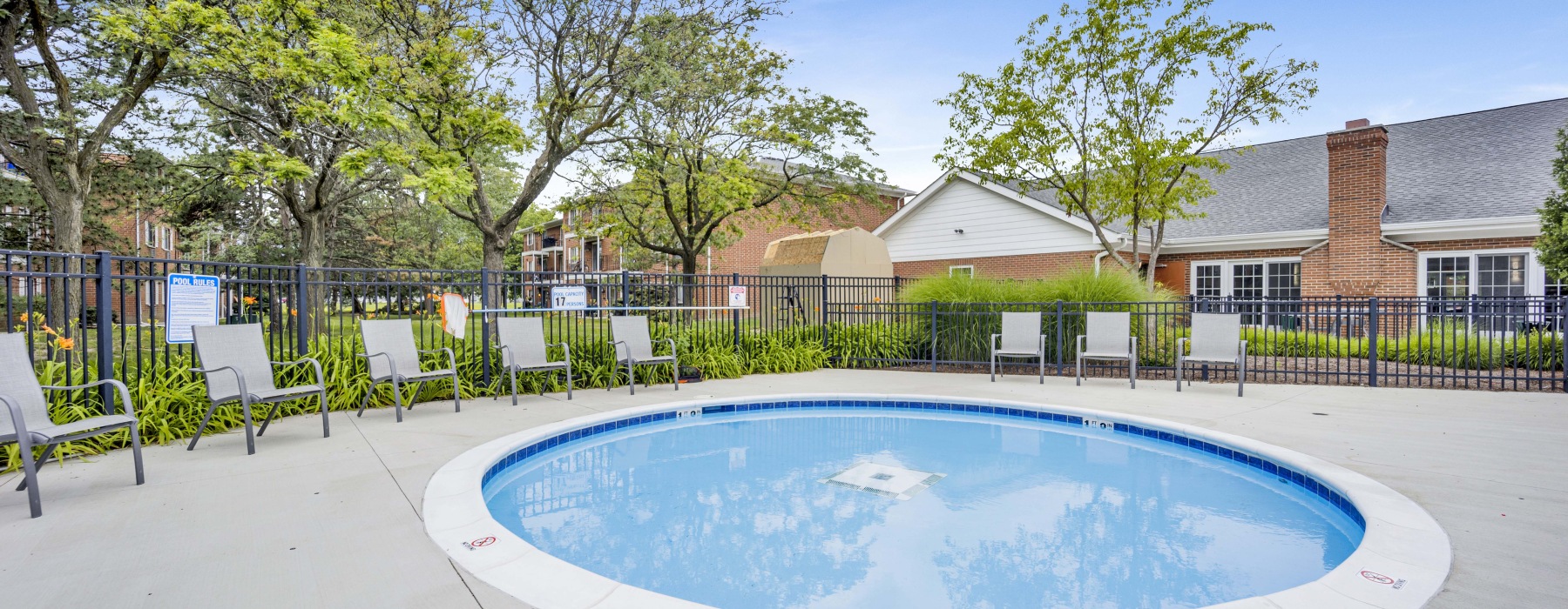 pool and reflections with reclining seats and modern stonework